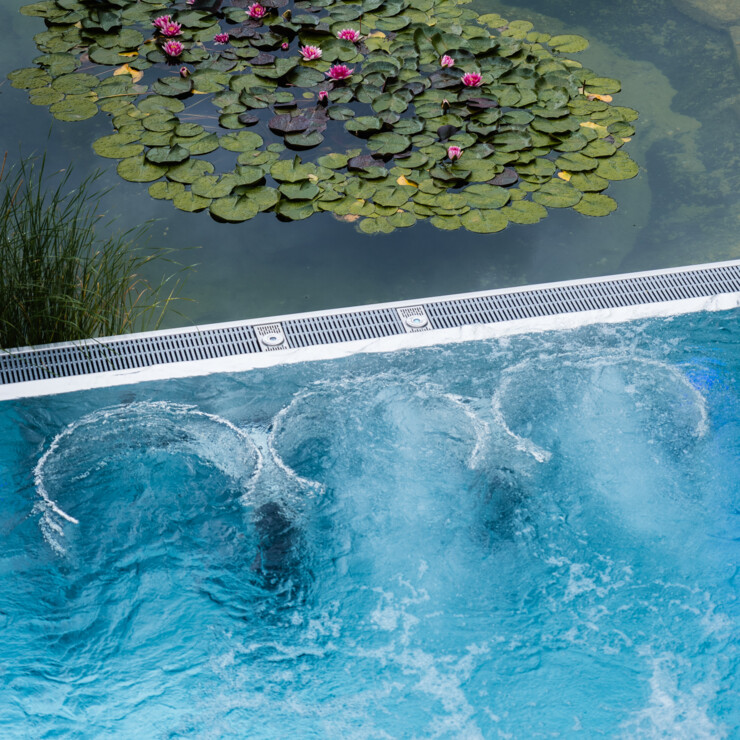 Natural swimming pond combined with whirlpool